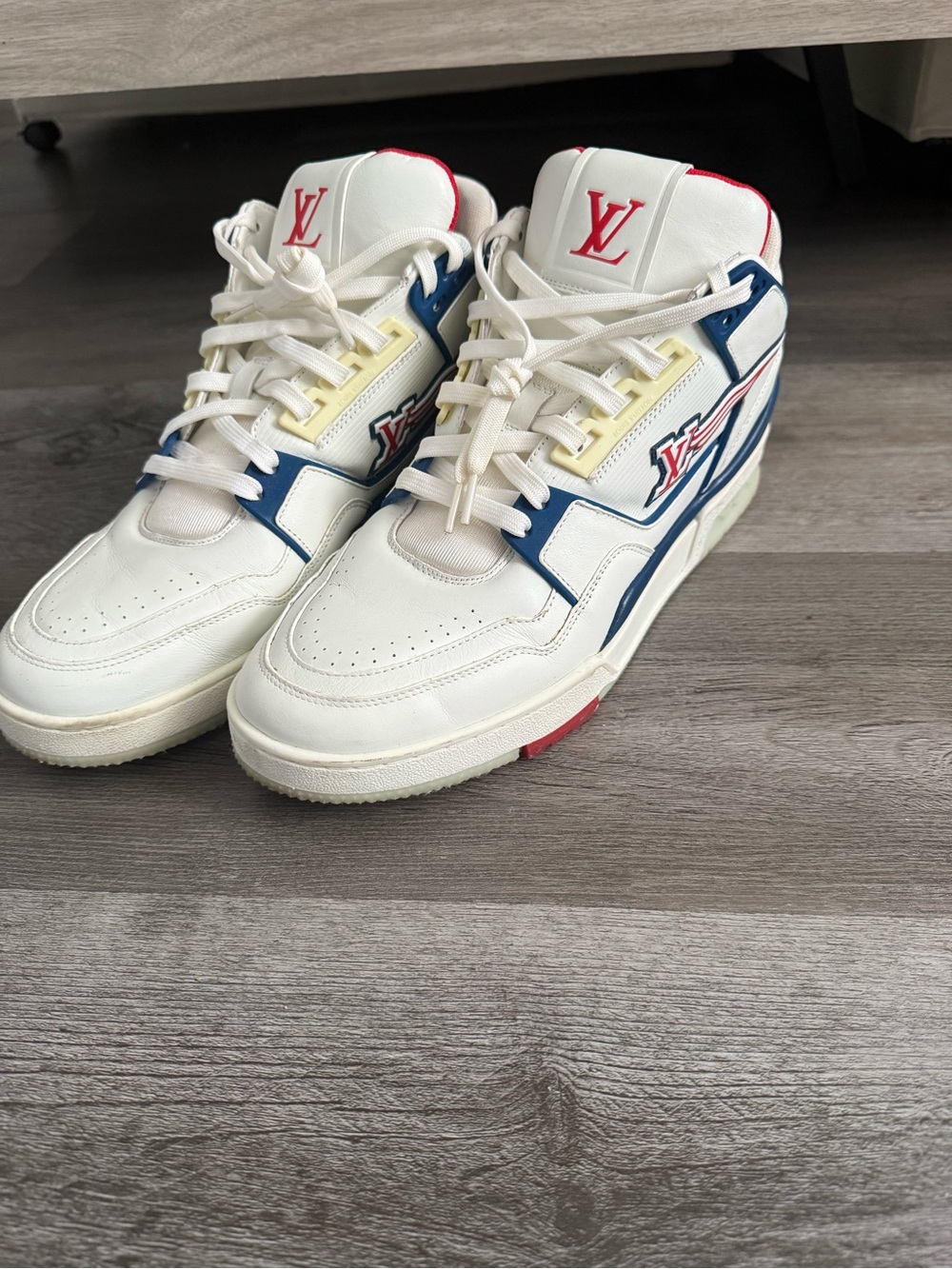 Louis Vuitton White High-Top Sneakers with Blue and Red Accents